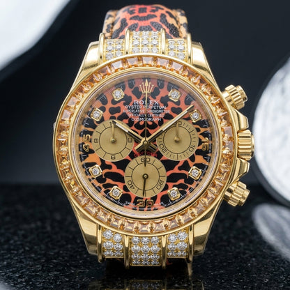 Leopard dial gold chronograph on a matching printed strap worn under a suit cuff