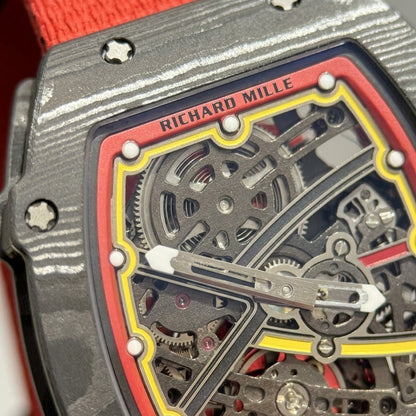 Macro of the open skeleton dial with the red flange, the yellow track round the white luminous markers and the dark X-shaped bridge