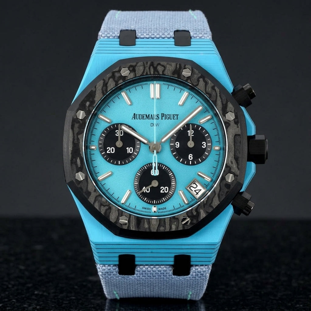 Octagonal chronograph with a sky-blue case, a black forged-carbon bezel and a sky-blue dial, upright on polished black granite