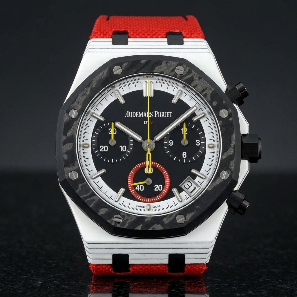 White octagonal chronograph with a black carbon bezel and a black dial, upright on polished black granite