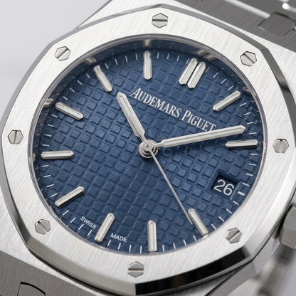 Close macro of the blue tapisserie dial and bezel screws