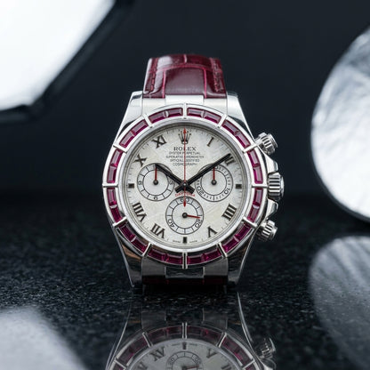 Studio photograph of the Ruby Baguette Bezel on black granite