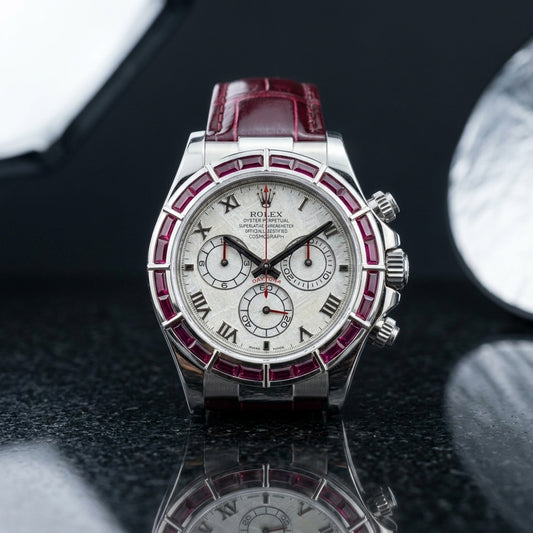 Studio photograph of the Ruby Baguette Bezel on black granite
