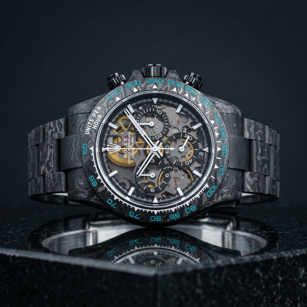Forged carbon skeleton chronograph with cyan bezel numerals on black granite
