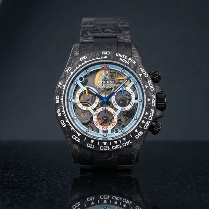 Forged carbon skeleton chronograph with an ice-blue skeleton dial on black granite