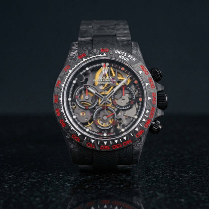 Forged carbon skeleton chronograph with red bezel numerals on black granite