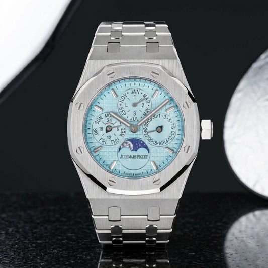 Octagonal perpetual calendar watch with an ice blue dial on black granite