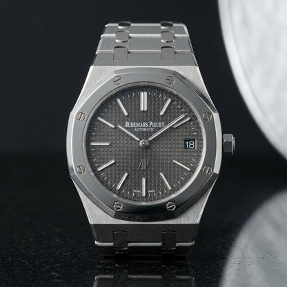 Extra-thin steel octagonal sports watch with a slate tapisserie dial on pale stone