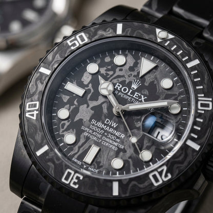 Macro of the carbon-grain dial and dive bezel