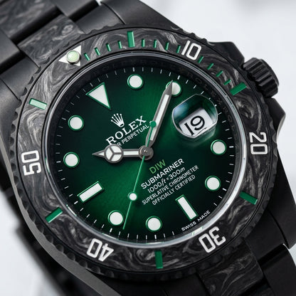 Macro of the green gradient dial and carbon dive bezel