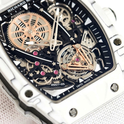 Macro of the open skeleton dial inside the white case: rose-gold spoked wheel, pink jewels and the tourbillon-style cage at six