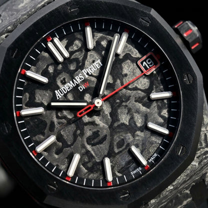 Macro of the marbled carbon dial and its red accents