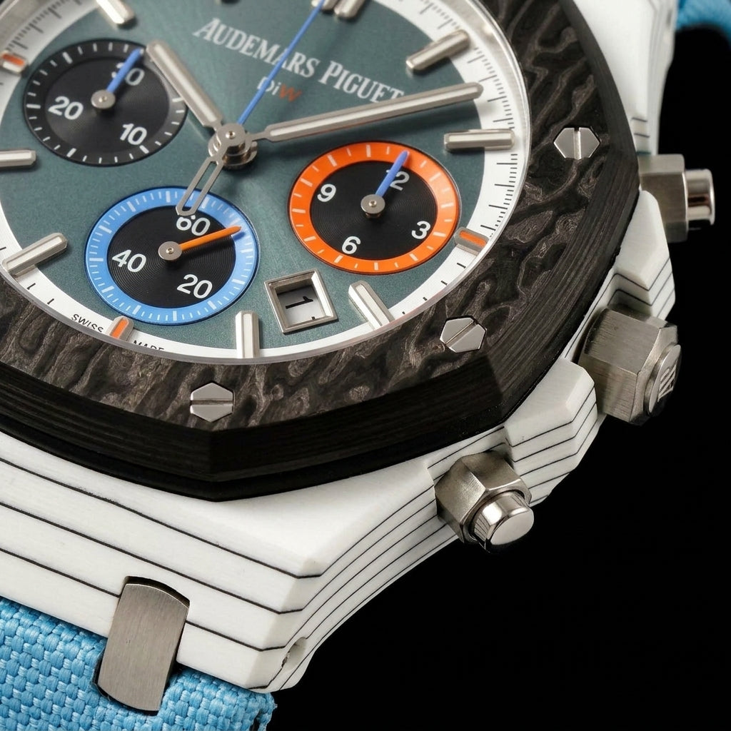 Macro of the teal dial, orange and blue counters and carbon bezel